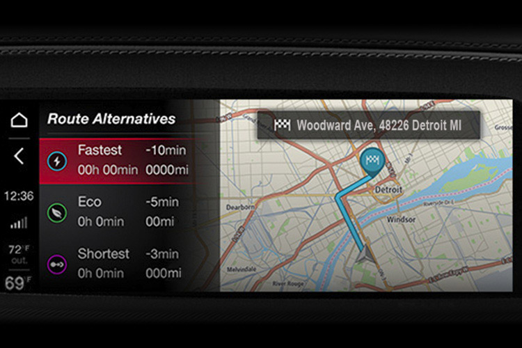 The Uconnect touchscreen in a 2026 Alfa Romeo Giulia displaying a navigation map and route alternatives.