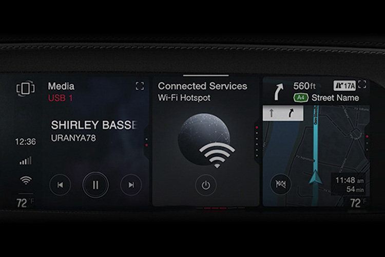 The Uconnect touchscreen in a 2026 Alfa Romeo Giulia displaying a music selection, Wi-Fi hotspot access and a navigation map.